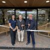 Lara White, Malcolm White and Bob Joy cutting the ribbon Three people cutting the ribbon on a new entrance to Otter Garden Centres in Ottery St Mary