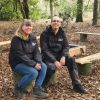 Two people sitting in Escot woods
