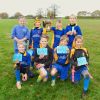 Landscore Tag Rugby Team with their Trophy