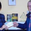 Tom Devin of the Per Mare Per Terram Masonic Lodge No 9355 presents a cheque for £300 to Pete’s Dragons project manager Kate Bedding.  