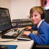 Year 4 BCPS student using desktop computer and headphones