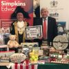 Lord Mayor of Exeter, Councillor Rob Hannaford, and John Coombs, partner at Simpkins Edwards, with auction and raffle items for The Really Big Quiz.