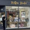 woman standing outside shop