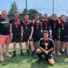 Marcel's Allstars, men's winners of the Exeter City FC One Game One Community Group community diversity football tournament, with Simon Kitchen from ECFC OGOC group, left. Photo: Alan Quick