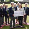 Nomads bowlers present a cheque for £1,500 to FORCE Cancer Charity