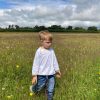 A blonde boy in a meadow