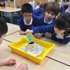 Children from the school experimenting with a foil 'volcano'