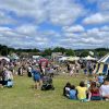 Image of visitors enjoying an outdoor summer community event. 