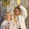 Two children take part in a science event