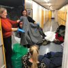 Rotary Club WrapUp campaign - volunteers sorting coats at Safestore.jpg