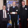 Peter Holman receiving the cheque from Ian Kingsbury accompanied by W. Bro. Clive Eden from St. Michaels Lodge in Dawlish.
