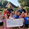 Wynstream School children present a cheque to FORCE Cancer Charity