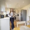 First-time buyer Zoe enjoying a coffee in her new kitchen after moving into Tilia Homes' Brook Manor development. First-time buyer Zoe enjoying a coffee in her new kitchen after moving into Brook Manor development.