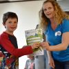 A young student receives his certificate