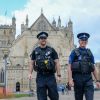 two policemen stand-in outside Exeter Cathedral