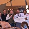 L-R: Caroline Creer, Fundraising and Communications Director at Devon Air Ambulance; James Dart, Co-Owner of Darts Farm; David FitzGerald, BBC Radio Devon Presenter; Alastair David, Master Butcher at The Butchers at Darts Farm; Michael Caines MBE, Head Chef at Gidleigh Park. The cheque for the sums raised from the sale of last year's winning sausage is presented to Caroline on behalf od Devon Air Ambulance.