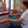 A resident at RMBI Home Cadogan Court (left) takes to the dance floor with one of the Home’s carers (right).