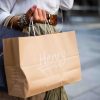 woman with a handful of shopping bags