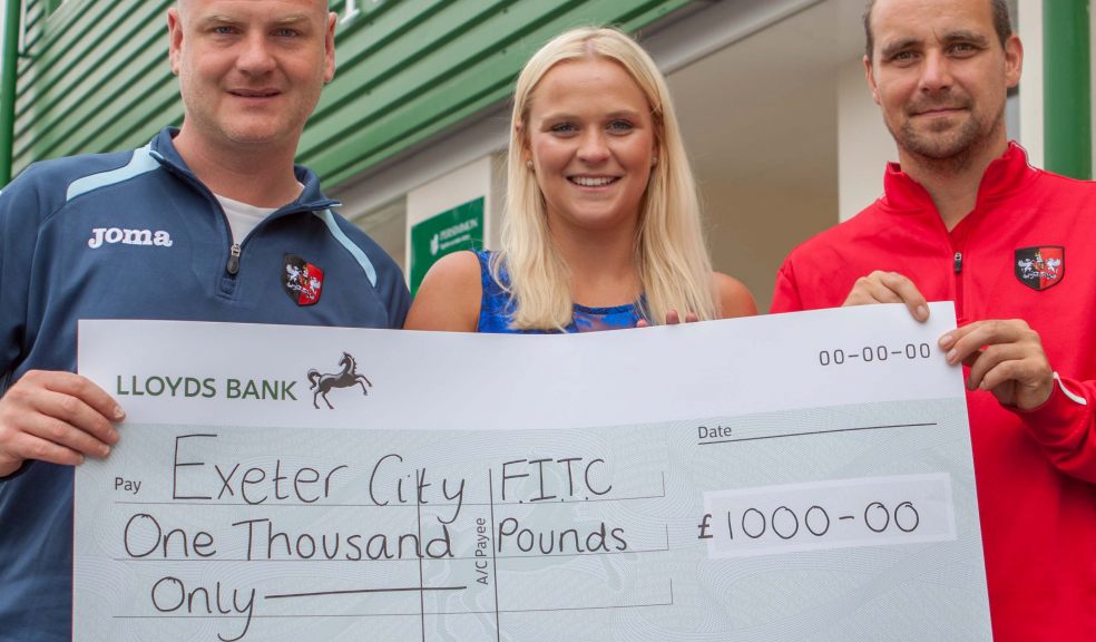 Alex Chilcott from Persimmon Homes presents Will Allan (left) and Dan Hewitt (right) with a grand cheque
