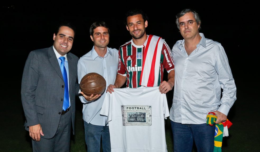 From left to right: Alexey Dantas (Vice-President of Public Relations for Fluminense); Ricardo Calcado (Exeter City representative in Brazil) with the 1914 ball; Fred (Brazil and Fluminense striker) with commemorative Exeter City 1914 tshirt; Eric de Menezes (Exeter City representative in Brazil) with a Brazil/Exeter scarf