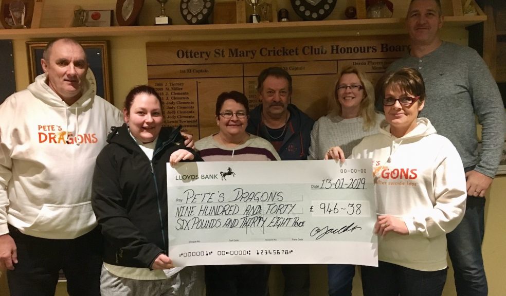 Gemma Youlden presents a cheque for £946 to Pete’s Dragons trustee and fellow Ottery St Mary resident Lesley Rowland. Also pictured (l-r) are Graham Rowland, Caroline and Dave Youlden, and Vicky and Rob Johns of Ottery Cricket Club.  