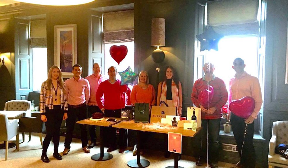 Burrington Estates Employees all in Pink for Cancer, with their fantastic spread of Raffle Prizes