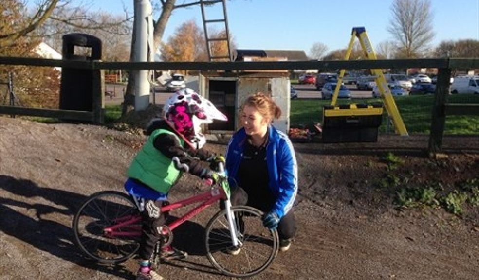 Molly Pattison coaching a young BMX cyclist