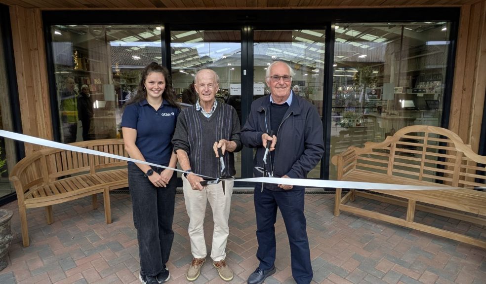 Lara White, Malcolm White and Bob Joy cutting the ribbon Three people cutting the ribbon on a new entrance to Otter Garden Centres in Ottery St Mary