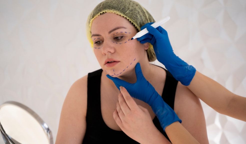 Young woman with marker traces on face
