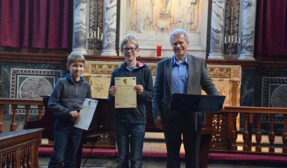 Albert Hughes and Tom Bracey receiving their final round certificates from Peter Millican, Professor of Philosophy at Hertford College, University of Oxford.