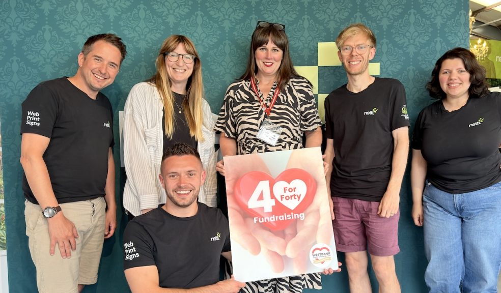 Westbank's Katie Elliott, centre, with the supportive team at Nettl