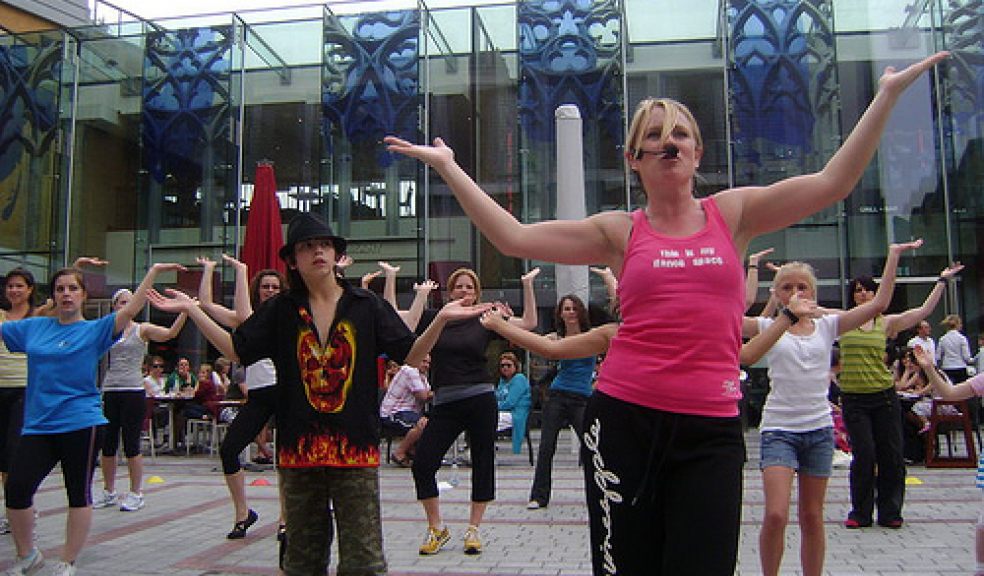 Mandi leading a group of dancers in live demo at Princesshay