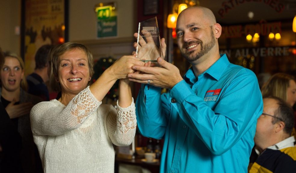 Simon Privett accepts his award from Jane Riley (trustee on Epilepsy Action’s Council of Management)