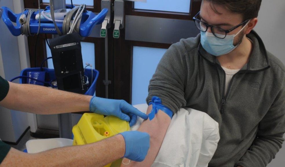 An Exeter student vaccinates at RD&E clinic