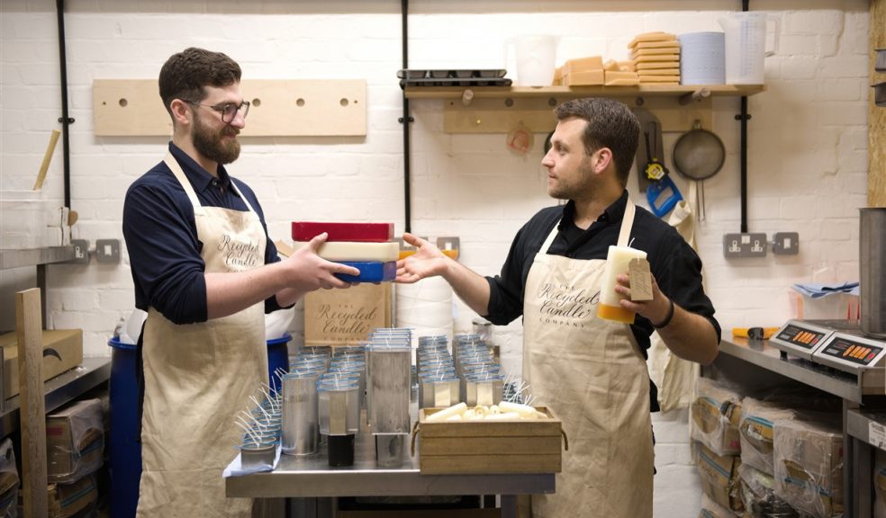 Two men making candles