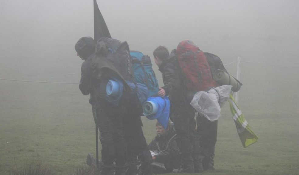 A Ten Tors team braces aginst the weather in 2013 photo via Ten Tors
