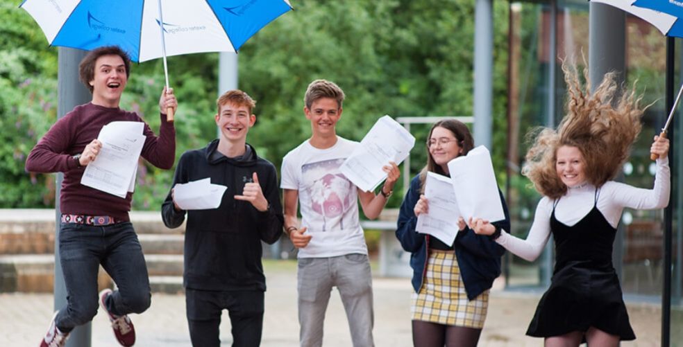 students celebrating exam result success