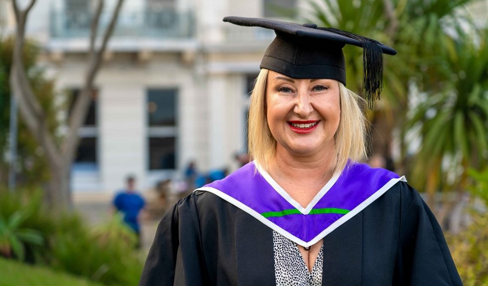 Graduate Amie Harris from Exeter is celebrating achieving her degree