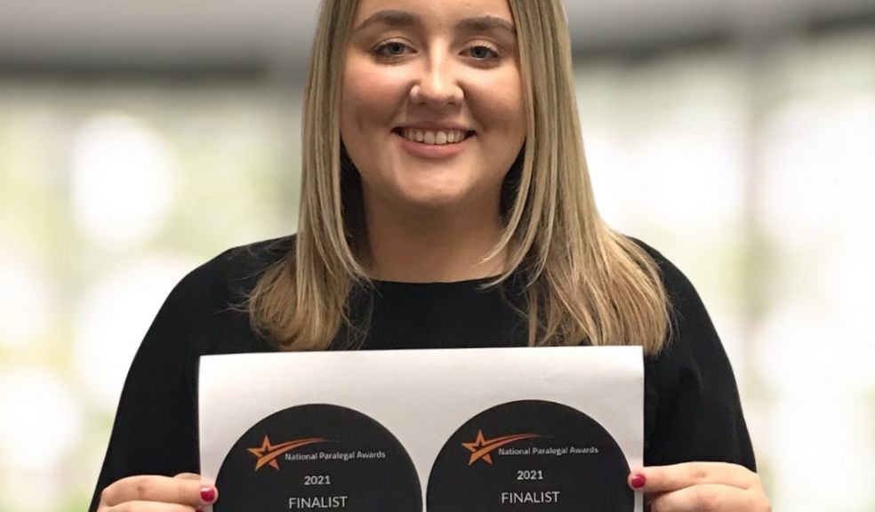 Paralega Becka Coombes Paralegal holding certificates