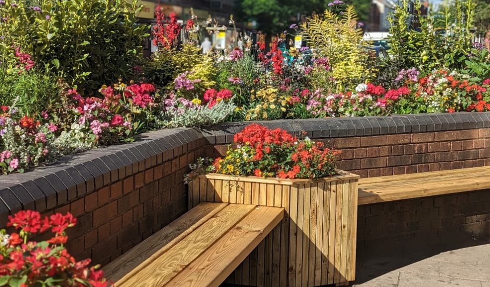 Parklet bench surrounded by flowers
