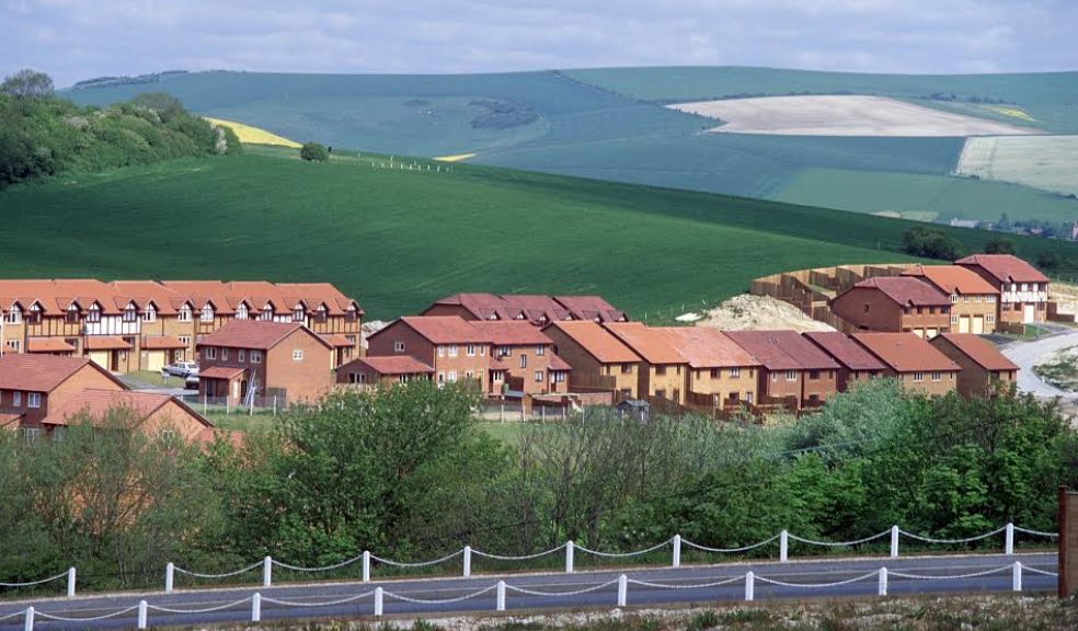 How many new homes need to be built in Devon?