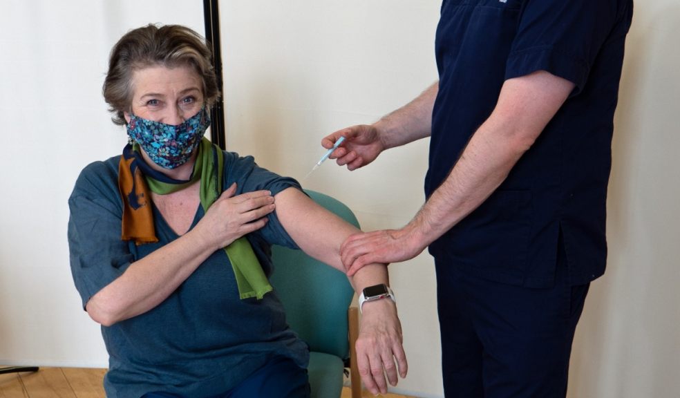 Dr Jon Williams of Amicus Health gives Caroline Quentin her vaccine