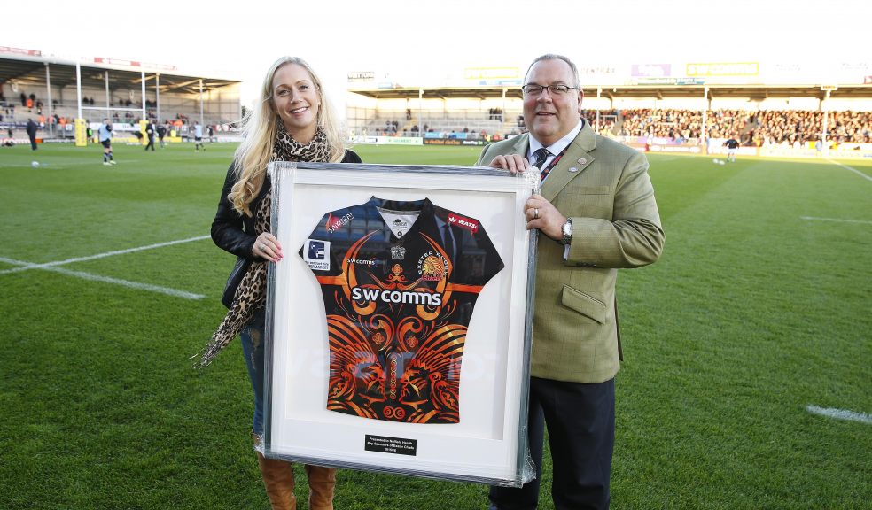 Keiron Northcott, Deputy Chief Executive of Exeter Chiefs presents Anna Pryce, Sales & Services Manager at Nuffield Health Exeter Hospital, with a signed jersey ahead of the match with London Irish.