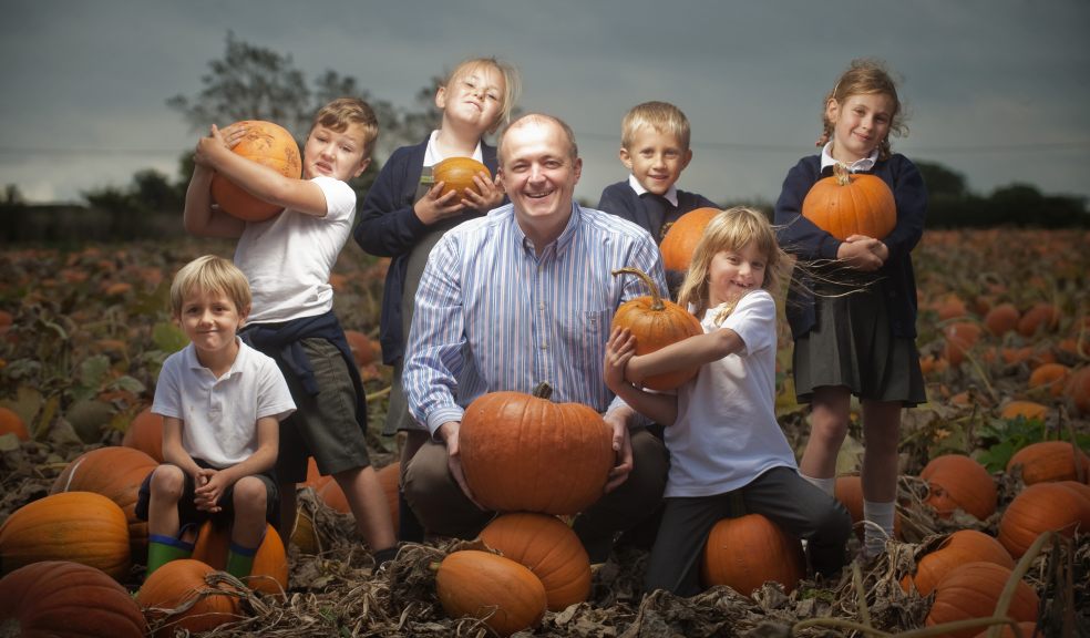 Chris Down and pupils from Clyst St Mary Primary School amongst the 22,000 pumpkins