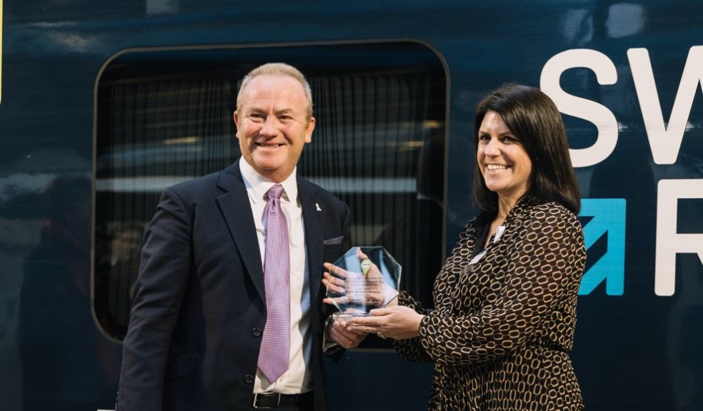 Claire Mann receives an award on behalf of SWR for outstanding commitment to safeguarding on the railway