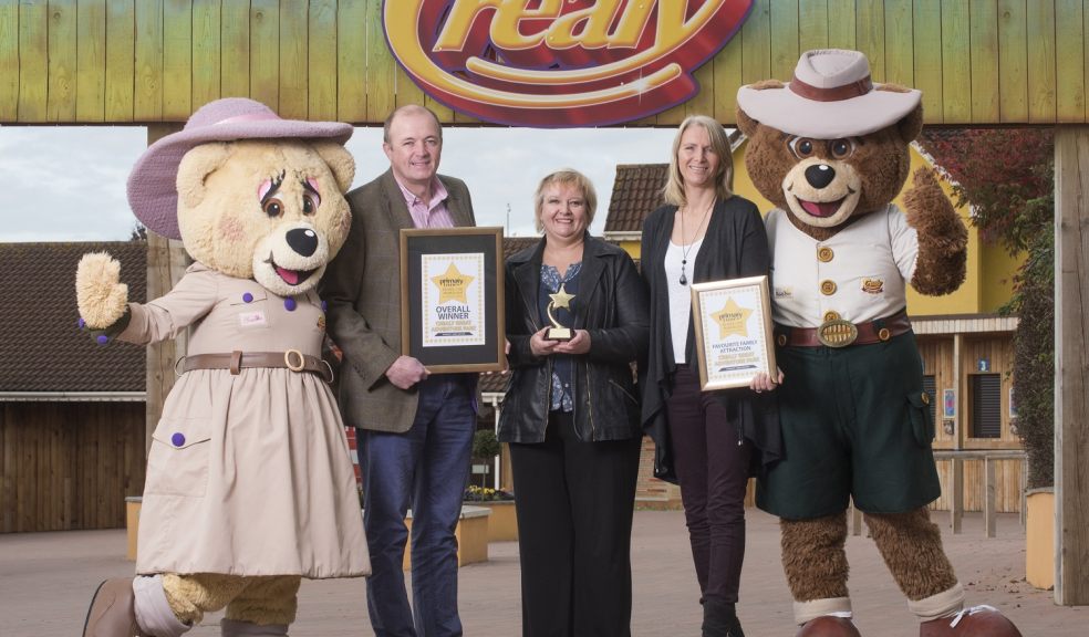 L-R: Chris and Katie Down (Crealy Adventure Park & Resort) collecting their awards from Linda Edwards (Primary Times) centre.