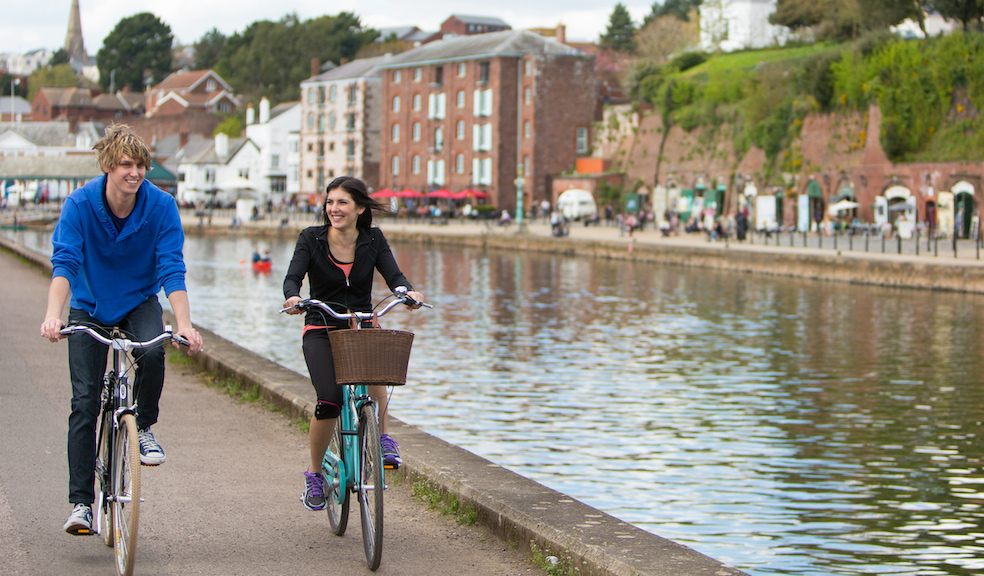 Picture of people cycling near to Exeter Quay