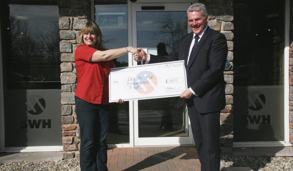 MD Ben Pyle presents Devon Air Ambulance with a cheque for £502