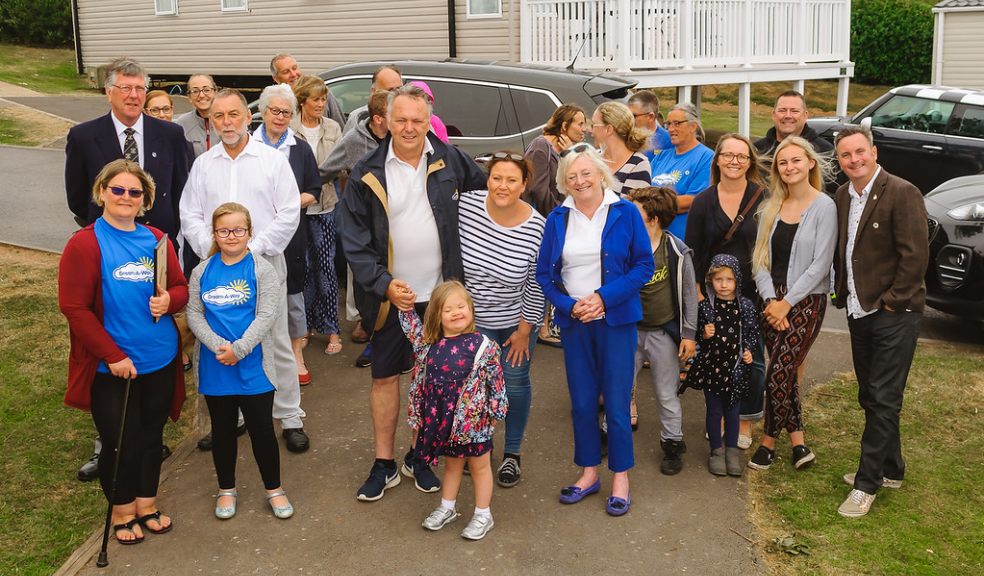 Jeff Merrett MBE. With Jessica Boyle surrounded by Families and Volunteers and in the second row are Tony Jordon & Clive Eden representing the Devonshire Freemasons.
