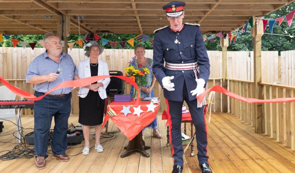 David Fursdon, Lord Lieutenant of Devon, cuts the ribbon to officially open the craft cabin